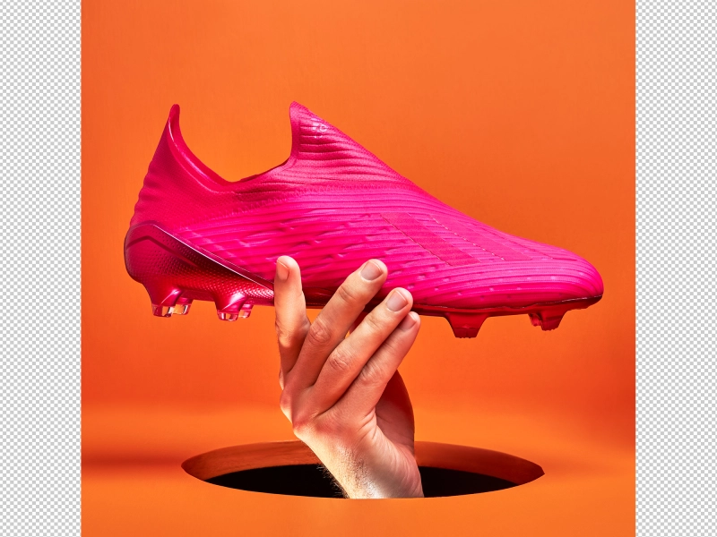 Original product photo of Adidas soccer cleats with studs on artistic stand 1.jpg