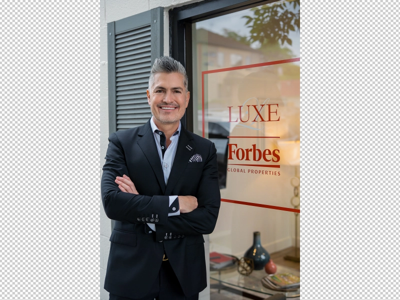 Professionally edited portrait of a real estate agent featuring improved exposure, natural skin enhancement, softened reflections, and production-ready color balance..jpg Professionally edited portrait of a real estate agent featuring improved exposure, natural skin enhancement, softened reflections, and production-ready color balance..jpg