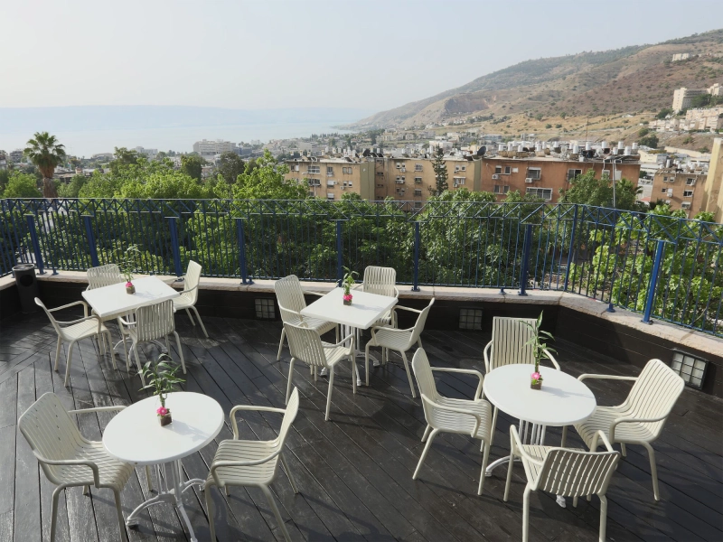 Before editing photo of commercial property rooftop café with flat colors, uneven white balance, and visible distractions in the dining and terrace area.jpg Before editing photo of commercial property rooftop café with flat colors, uneven white balance, and visible distractions in the dining and terrace area.jpg