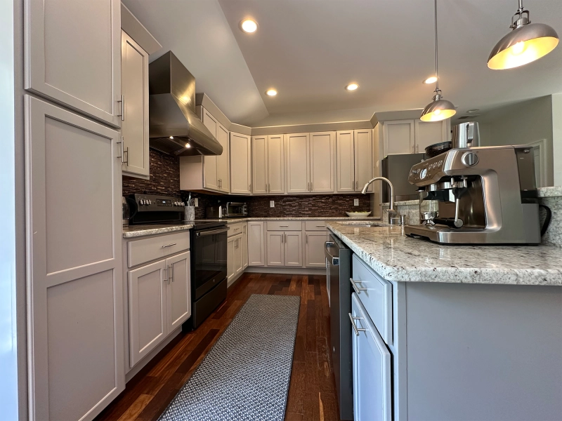 Before editing image of residential kitchen with uneven lighting, color imbalance, slight perspective distortion, and minor visual distractions.jpg Before editing image of residential kitchen with uneven lighting, color imbalance, slight perspective distortion, and minor visual distractions.jpg