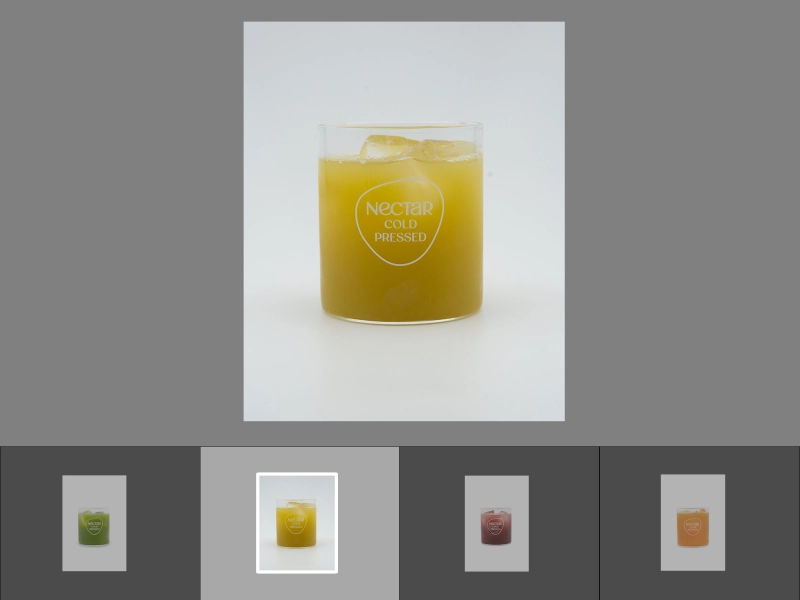 Before batch editing image of beverage in a glass with ice cubes, uneven lighting, muted tones, and reduced clarity in the drink and glass.jpg Before batch editing image of beverage in a glass with ice cubes, uneven lighting, muted tones, and reduced clarity in the drink and glass.jpg